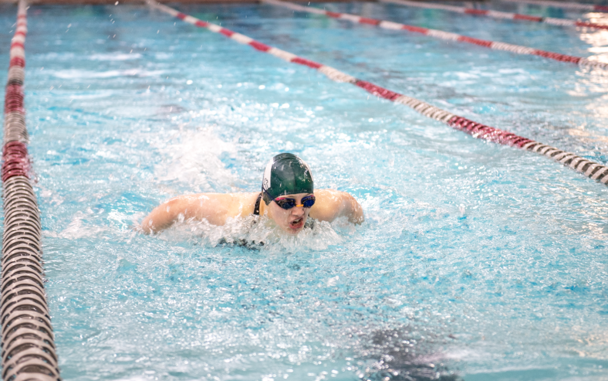 2.1.25 Junior Joanne Ragsdale swimming 100 Butterfly at Missoula. 